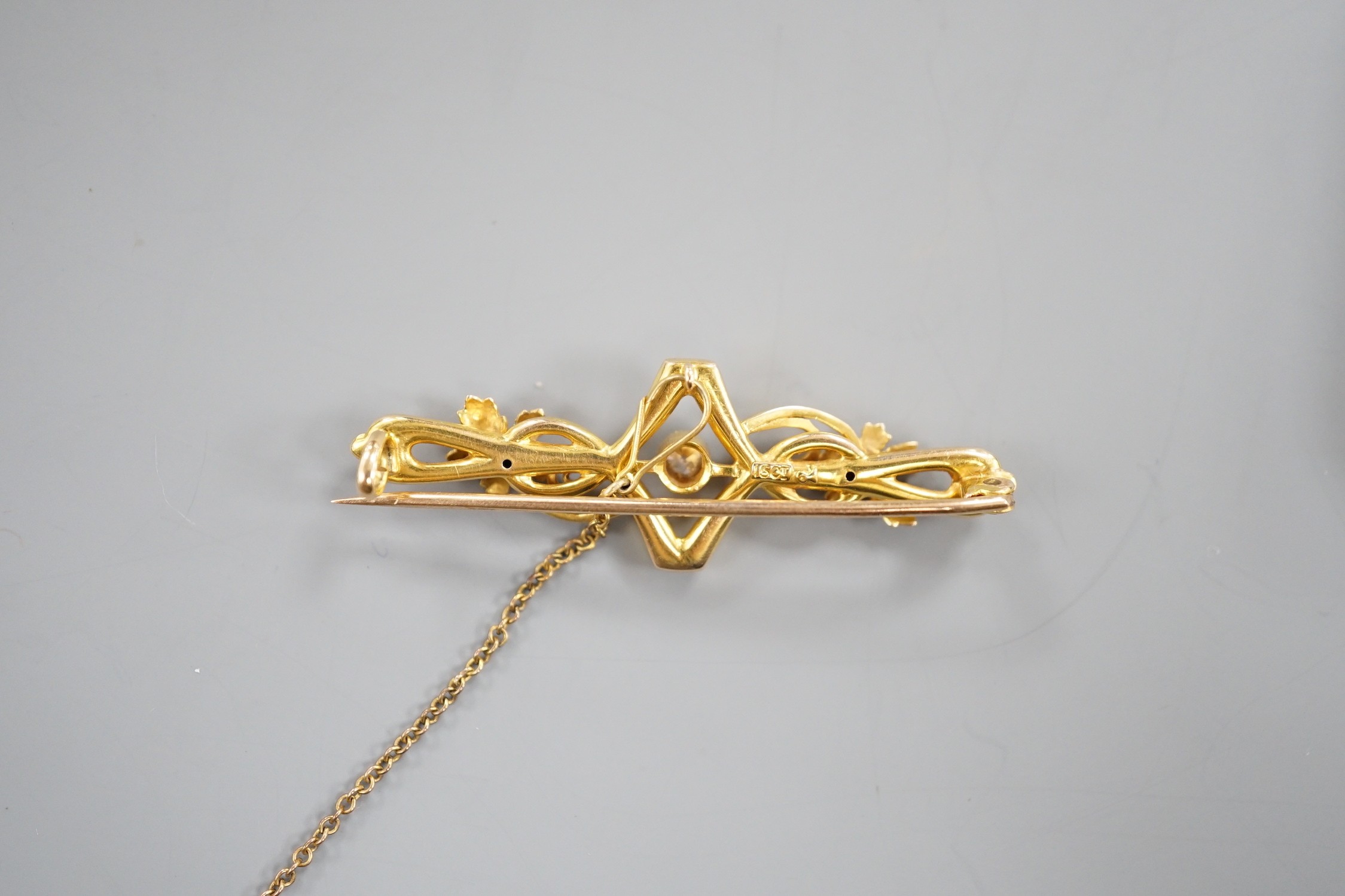 An Edwardian 15ct, seed pearl and diamond set bar brooch, 43mm, gross weight 3.1 grams.
